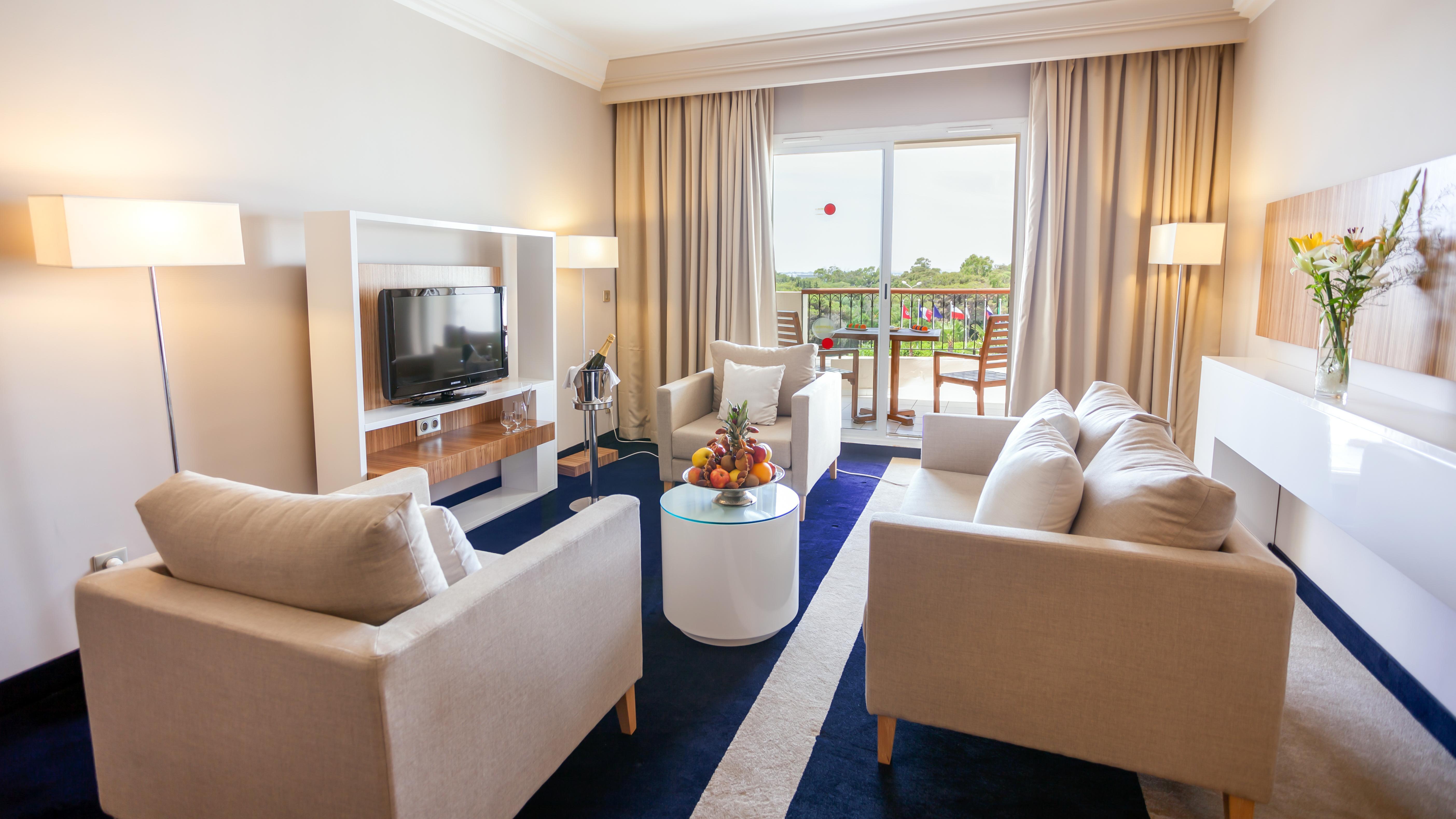El Mouradi Gammarth Hotel Exterior photo A living room in a hotel suite